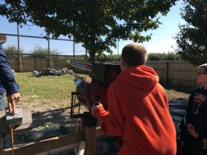Pumpkin shoot-out! They even earned cider slushies by hitting the targets.